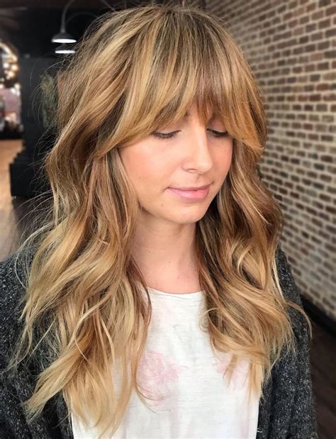 long shaggy hair with cheekbones-skimming bangs|how to cut shaggy bangs.